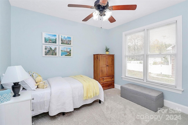 bedroom featuring ceiling fan and light colored carpet