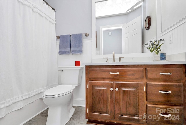 full bathroom featuring tile patterned floors, vanity, toilet, and shower / bath combo with shower curtain