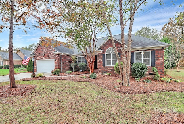 view of front of house featuring a garage and a front lawn