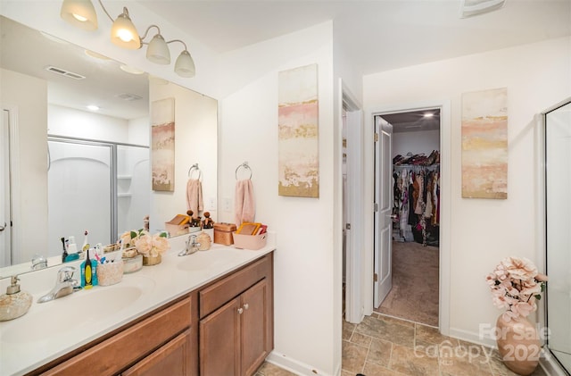 bathroom featuring vanity and walk in shower