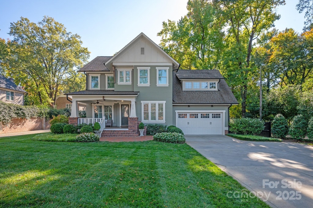 view of front of home with covered porch and a front yard