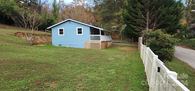 view of home's exterior featuring a yard