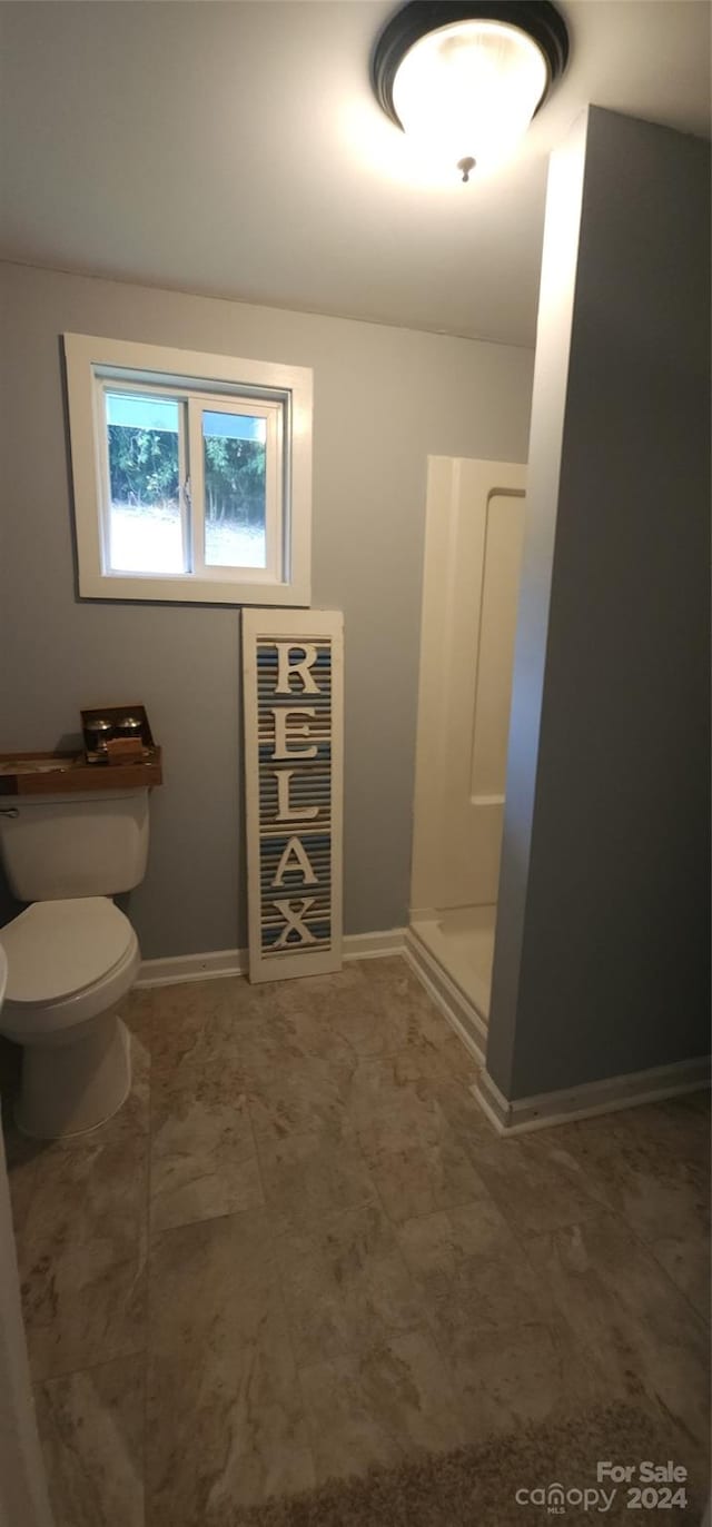 bathroom featuring toilet