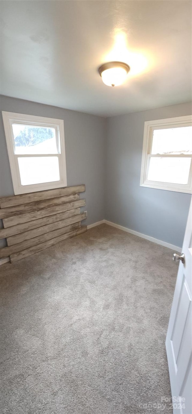 empty room with carpet flooring