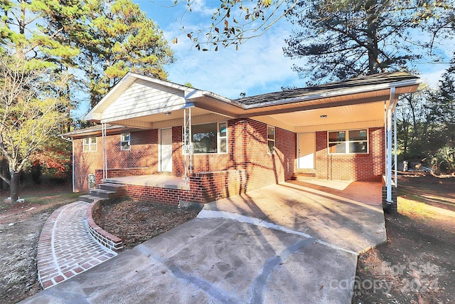 view of front of house with a carport