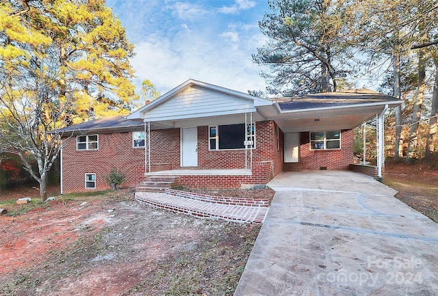 ranch-style home with a carport