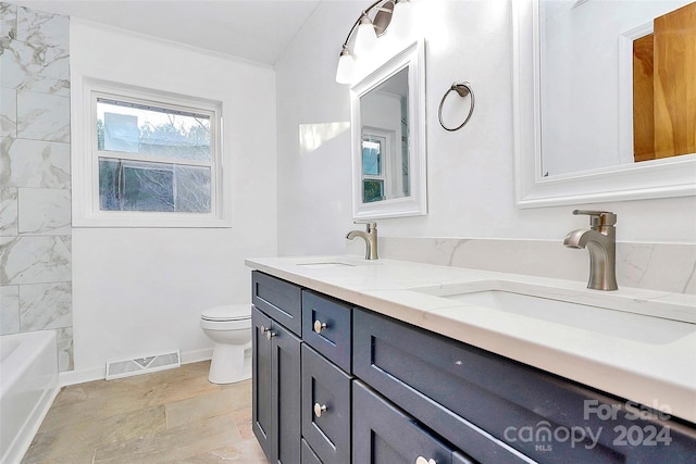 full bathroom featuring vanity,  shower combination, and toilet