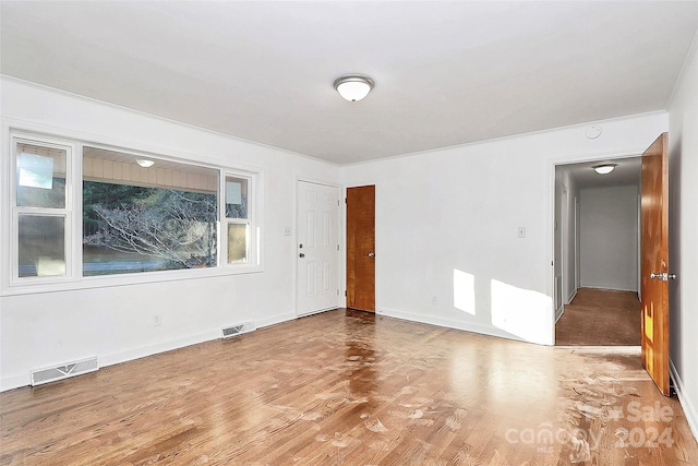 unfurnished room featuring wood-type flooring