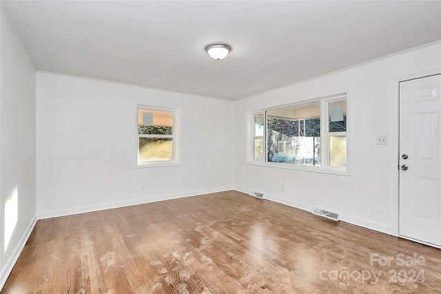 spare room featuring hardwood / wood-style flooring