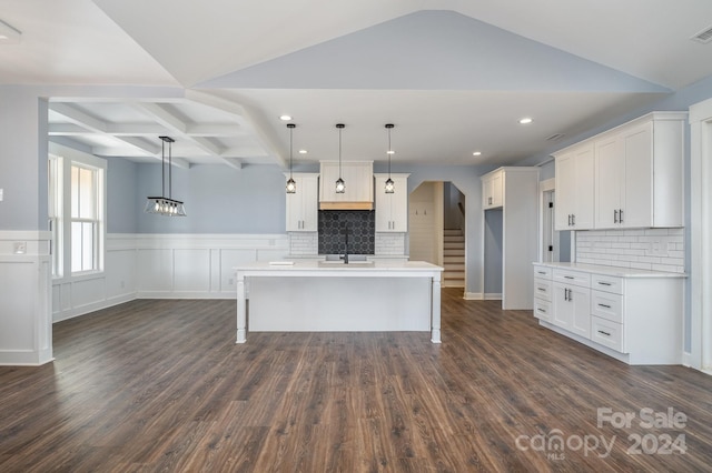 kitchen featuring decorative backsplash, dark hardwood / wood-style flooring, and hanging light fixtures