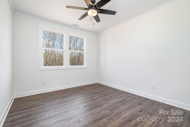 spare room featuring ceiling fan, dark hardwood / wood-style floors, and crown molding