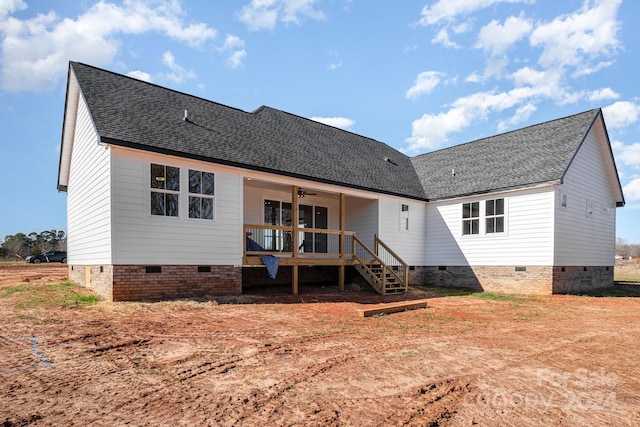 rear view of house with ceiling fan