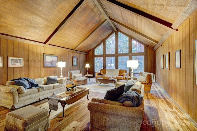 living room featuring light wood-type flooring, wooden walls, high vaulted ceiling, and wood ceiling