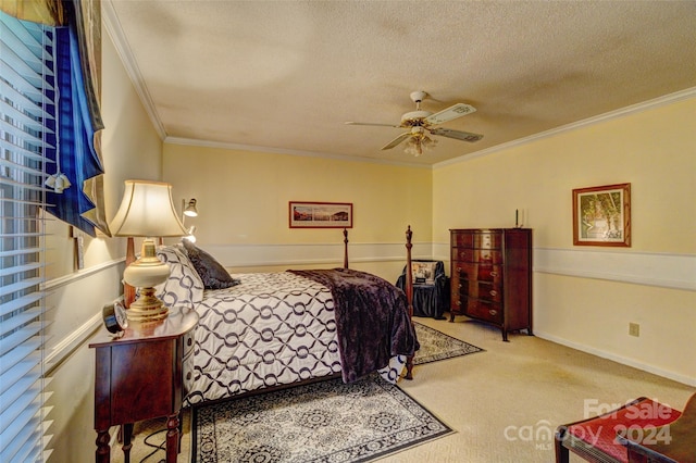 bedroom with a textured ceiling, carpet floors, ceiling fan, and crown molding