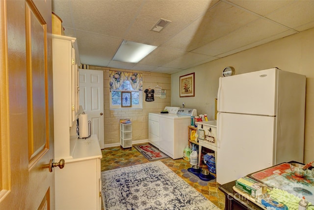 washroom featuring independent washer and dryer