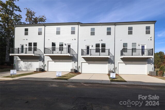 1909 Galloway Rd Lot 46, Charlotte, NC 28262 - view of front of property with an attached garage, central air condition unit, and driveway