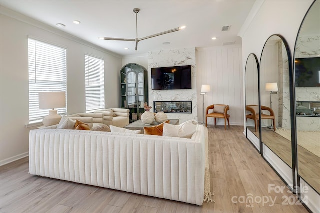 1909 Galloway Rd Lot 46, Charlotte, NC 28262 - living area featuring a high end fireplace, wood finished floors, crown molding, baseboards, and recessed lighting