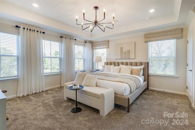 1909 Galloway Rd Lot 46, Charlotte, NC 28262 - carpeted bedroom featuring a raised ceiling, multiple windows, a chandelier, baseboards, and crown molding