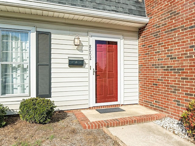 8002 Regent Park Ln, Charlotte, NC 28210 - view of exterior entry featuring a shingled roof