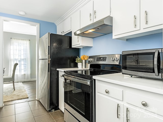 kitchen featuring appliances with stainless steel finishes, white cabinetry, and tile patterned floors