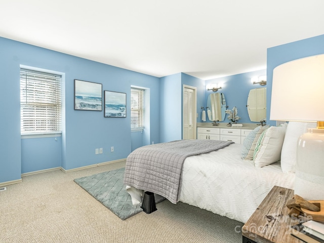 carpeted bedroom featuring a closet