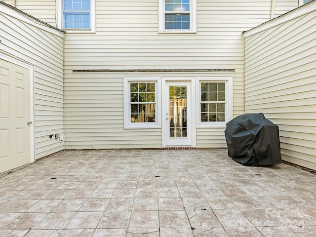 property entrance with a patio area