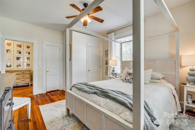 bedroom with dark wood-style flooring and a ceiling fan