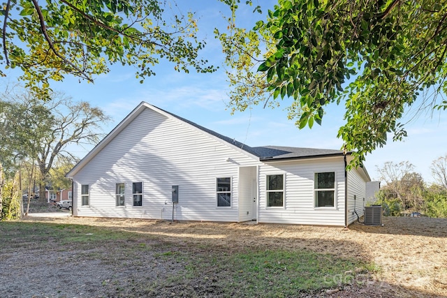 rear view of property featuring central AC unit