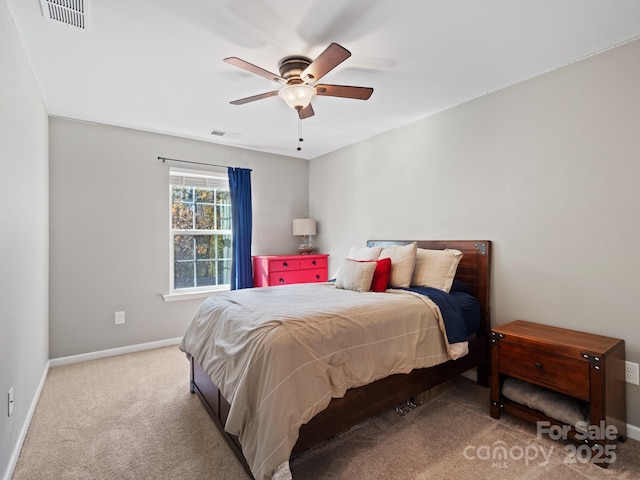 bedroom with baseboards, visible vents, and carpet flooring