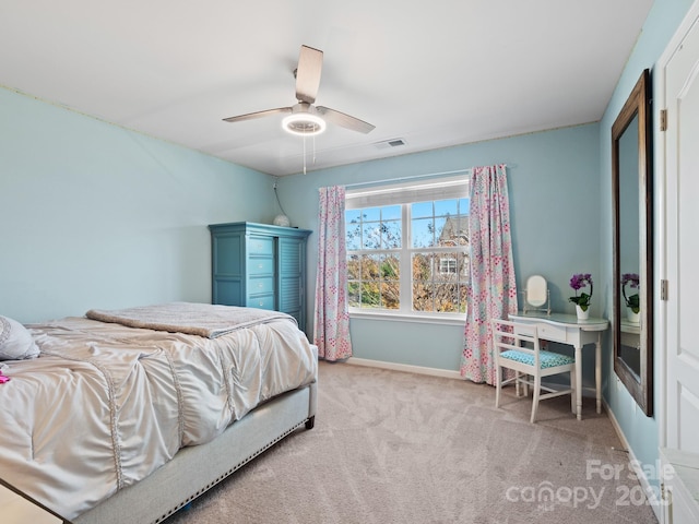 bedroom featuring a ceiling fan, carpet flooring, visible vents, and baseboards