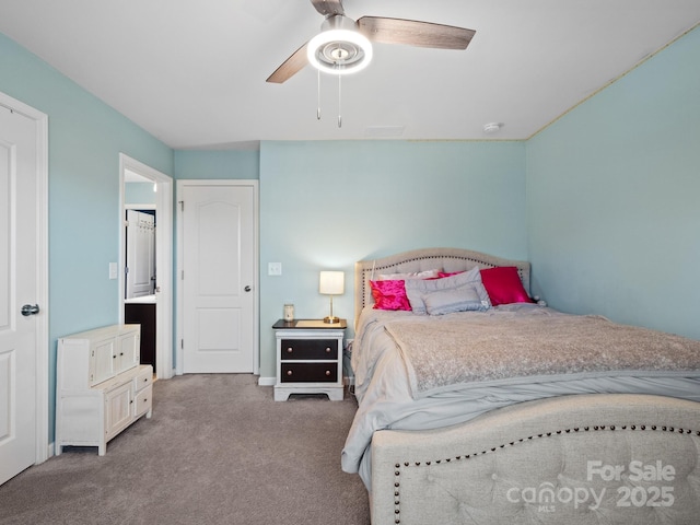 carpeted bedroom with visible vents and ceiling fan