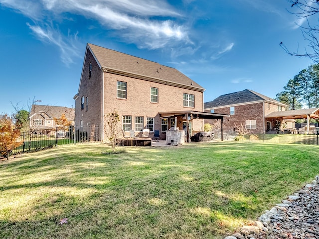 back of property with a patio, a lawn, and a fenced backyard