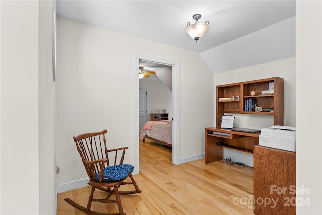 office featuring ceiling fan, wood-type flooring, and vaulted ceiling