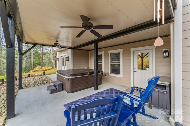 view of patio with a hot tub and ceiling fan