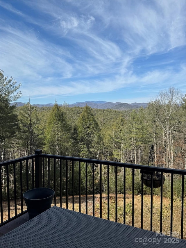 balcony with a mountain view and a forest view