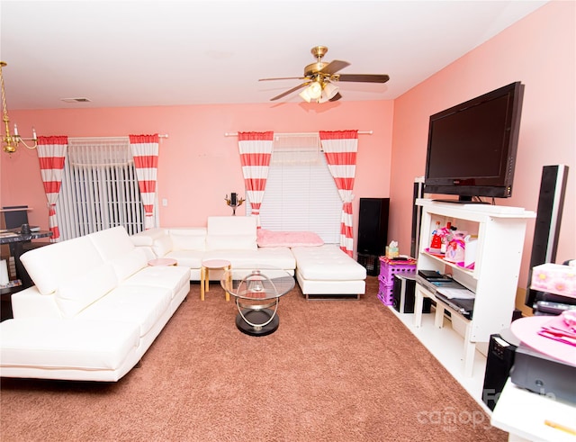 carpeted living room featuring ceiling fan