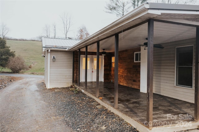 exterior space featuring ceiling fan