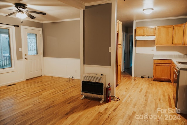 kitchen with crown molding, ceiling fan, light wood-type flooring, tasteful backsplash, and heating unit