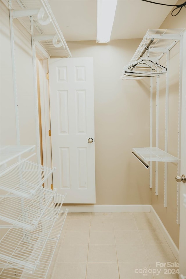 spacious closet with tile patterned flooring