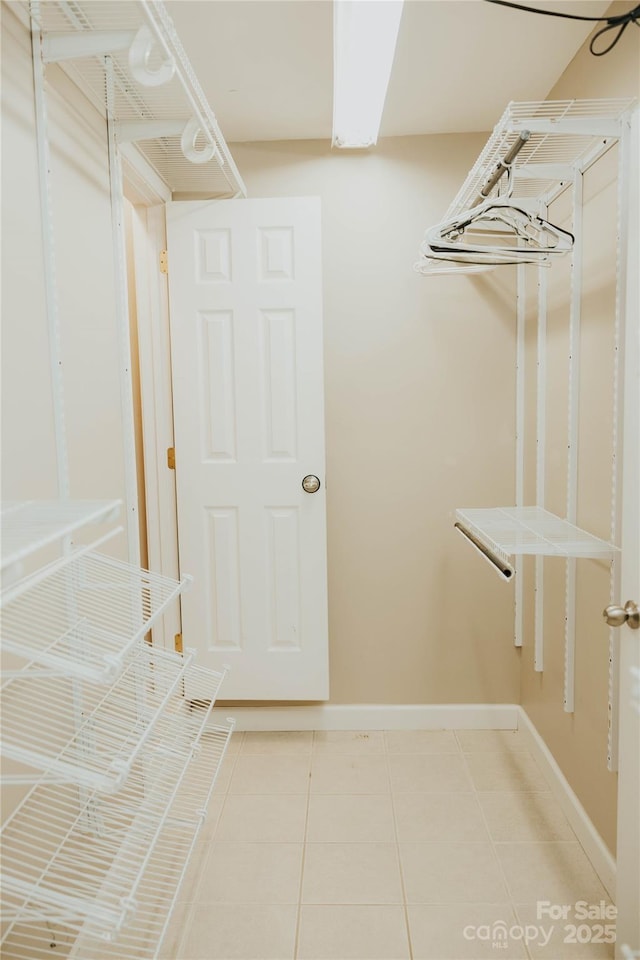 walk in closet featuring light tile patterned floors