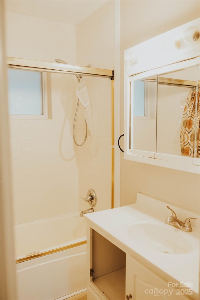 bathroom with shower / bathing tub combination and vanity