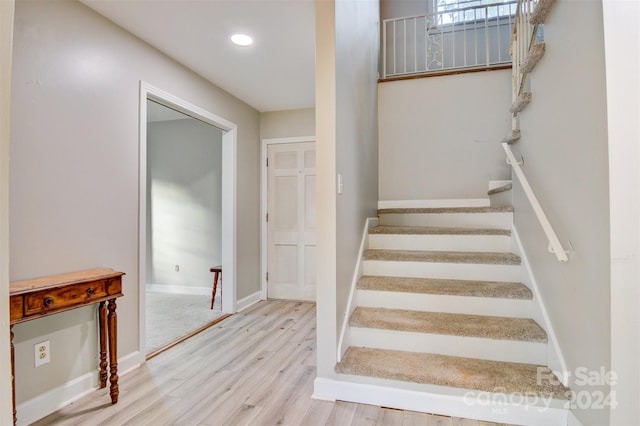 staircase featuring hardwood / wood-style floors