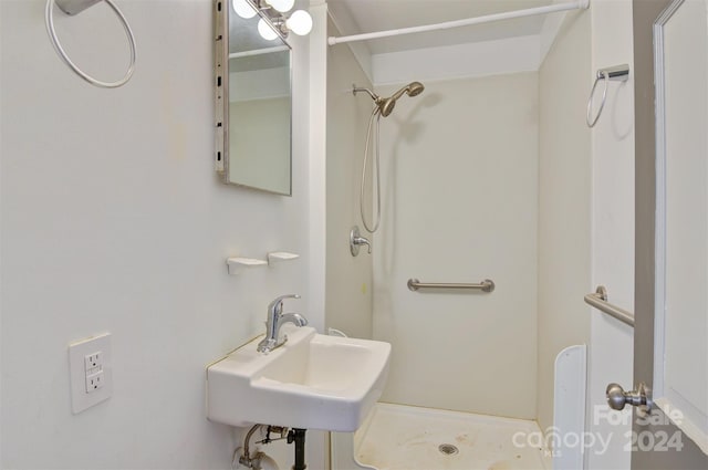 bathroom featuring a shower and sink