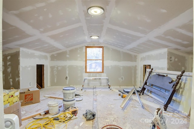 additional living space featuring lofted ceiling