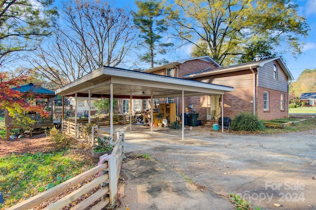 view of side of home with a carport