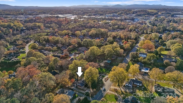 birds eye view of property with a mountain view