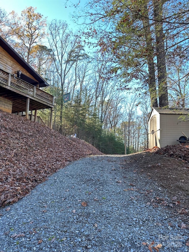 view of yard with a storage shed and an outdoor structure