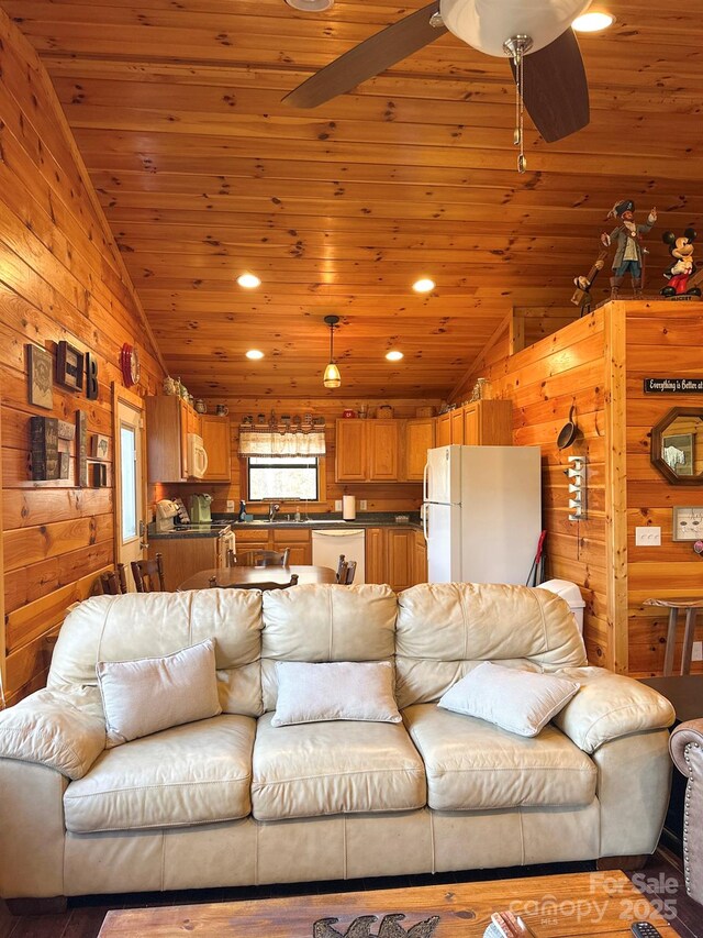 living room with recessed lighting, wood ceiling, wood walls, and vaulted ceiling