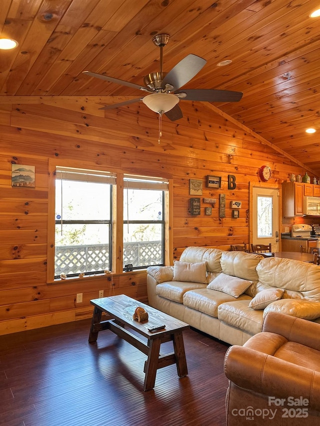 living room with lofted ceiling, dark wood-type flooring, wooden ceiling, and a ceiling fan