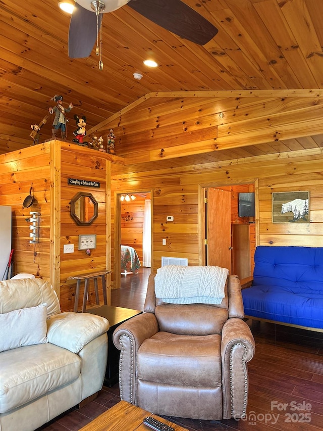 living area with wooden walls, wood finished floors, wooden ceiling, and vaulted ceiling